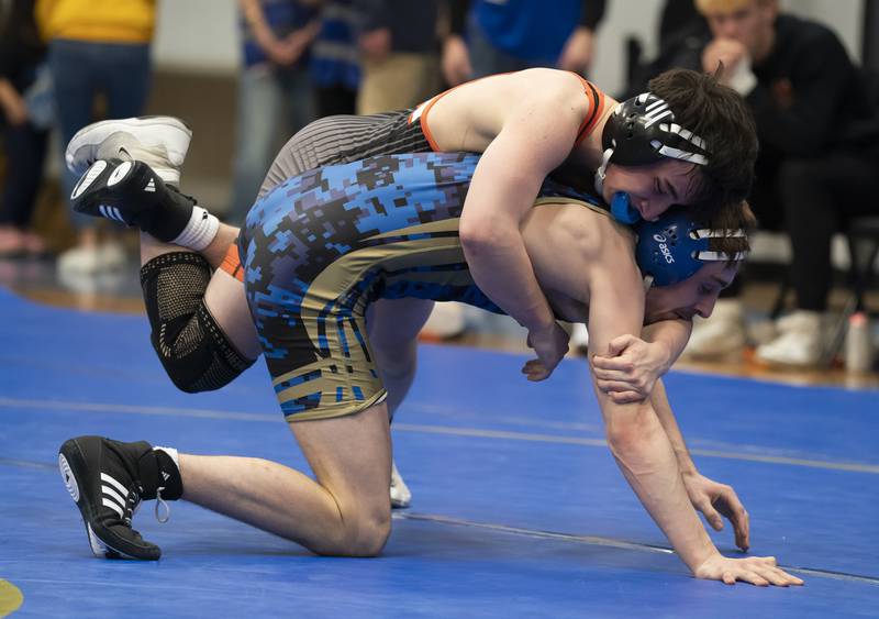 Crystal Lake Central's Daniel Snow takes on Wheeling's Max Katz in the 132 pound bout during the Class 2A Dual Team wrestling Sectional on Tuesday, February 25, 2025 at Wheeling High School.