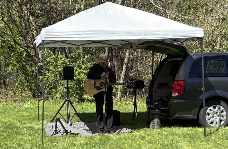 Todd Witek performs during a tribute to late local musician Kevin Kramer at the 10th annual Perfectly Flawed Earth Day cleanup at the I&M Canal’s Lock 14 on Saturday, April 18, in La Salle.