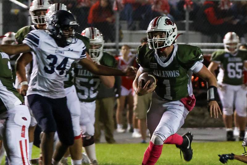Isiah Weibel of Streator runs ball whilst being tracked by Patrick Doss of Lisle on Friday, October 4, 2024 at Streator high school in Streator.