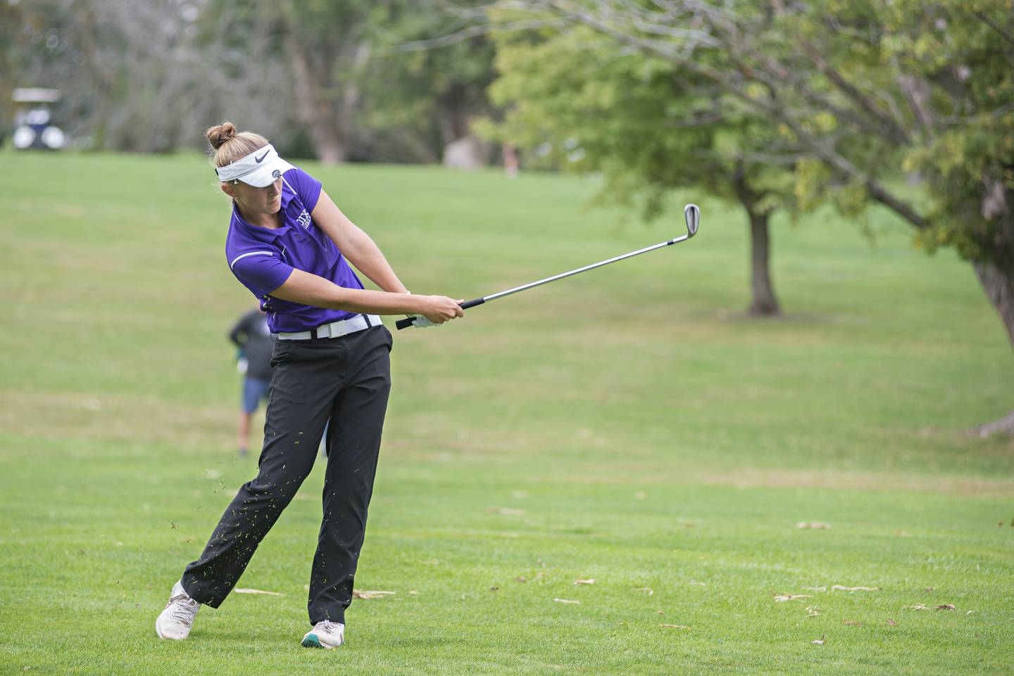 Dixon's Katie Drew takes a shot towards the #4 green during the girls class A sectionals Monday, Oct. 4, 2021 at Kewanee Dunes.