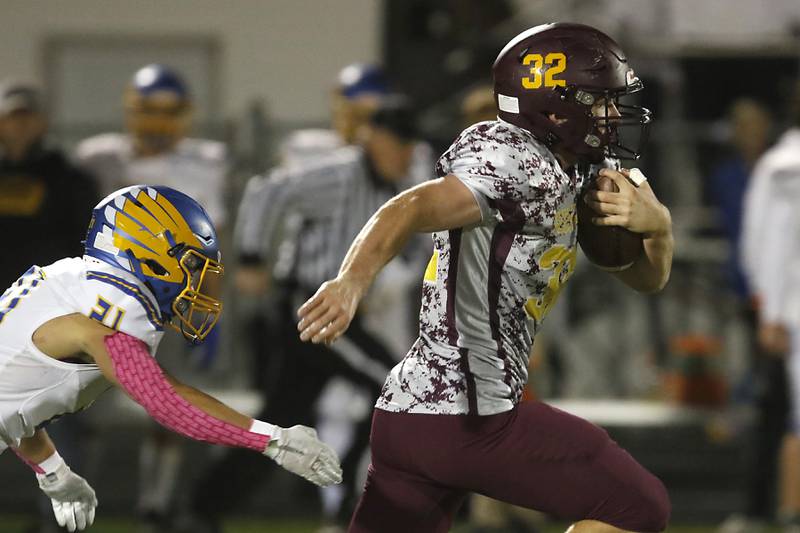 Richmond-Burton's Steven Siegel runs away from Johnsburg's Nicholas LoPresti as Siegel runs for a touchdown during a Kishwaukee River Conference football game Friday, Oct. 7, 2022, between Richmond-Burton and Johnsburg at Richmond-Burton Community High School in Richmond.