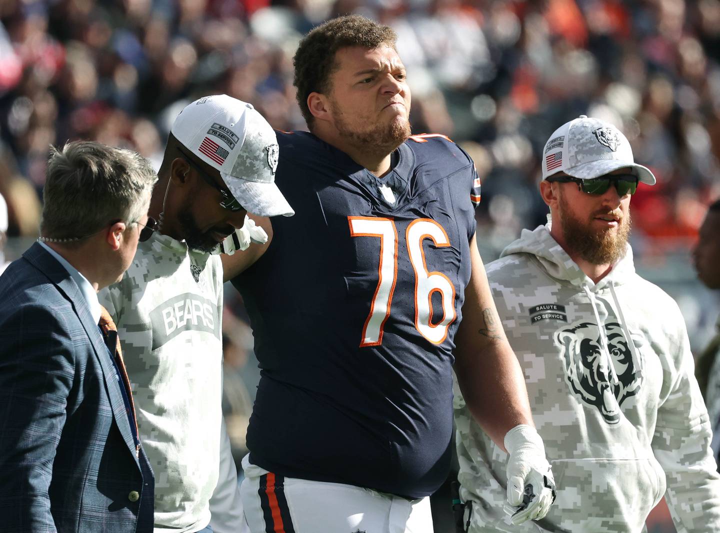 Chicago Bears guard Teven Jenkins is helped off the field after being injured during their game against the New England Patriots Sunday, Nov. 10, 2024, at Soldier Field in Chicago.