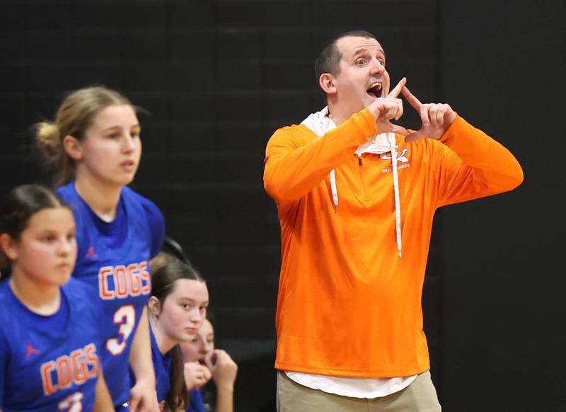 Genoa-Kingston girls head basketball coach Doug Brewington calls out a defense Monday, Dec. 8, 2025, during their game at Indian Creek High School in Shabbona.