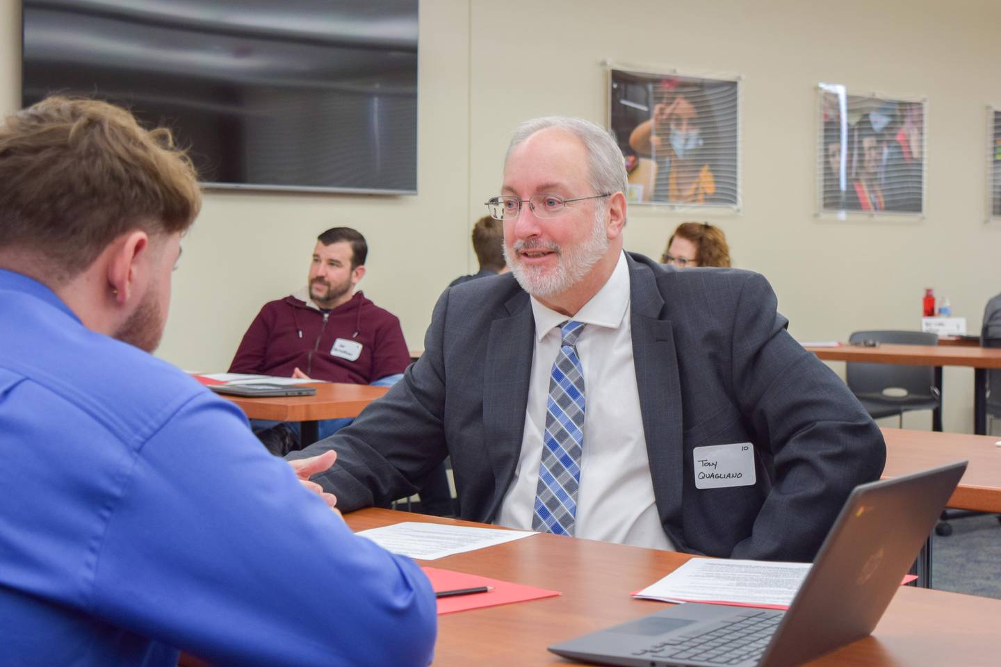 Tony Quagliano, president of the Huntley School District 158 school board, conducts a mock interview with Huntley High School senior Anthony Becker.