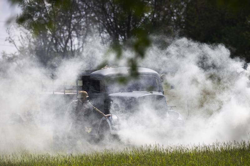 Smoke is used to mask troop movements Saturday, May 16, 2026, during a reenactment of the Battle of Anzio in Franklin Grove.