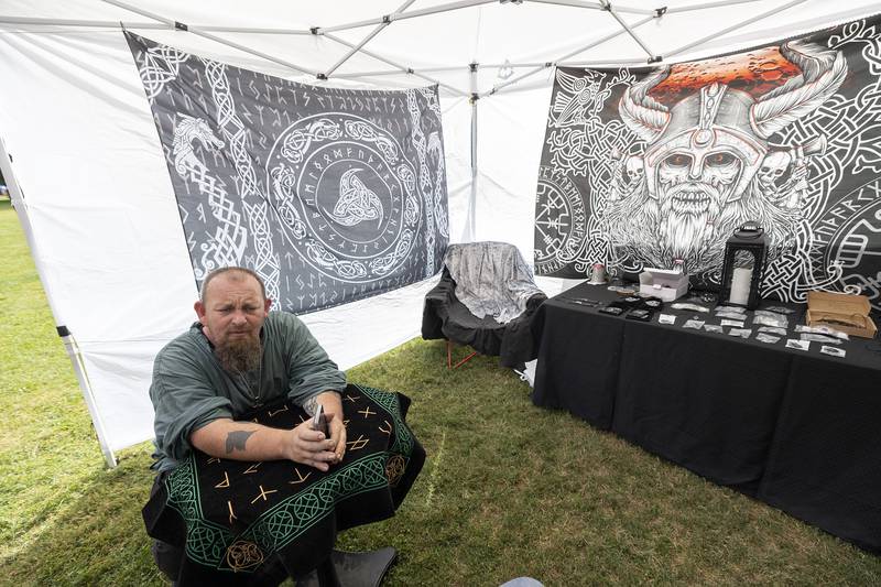 Rune reader Mike Mathews of Oregon set up a booth at Lowell Park’s Fall and Fantasy Fest Saturday, Sept. 21, 2024, in Dixon. Runes are the symbols of the ancient alphabet of the Germanic people and are thought to be able to provide protection among other powers.