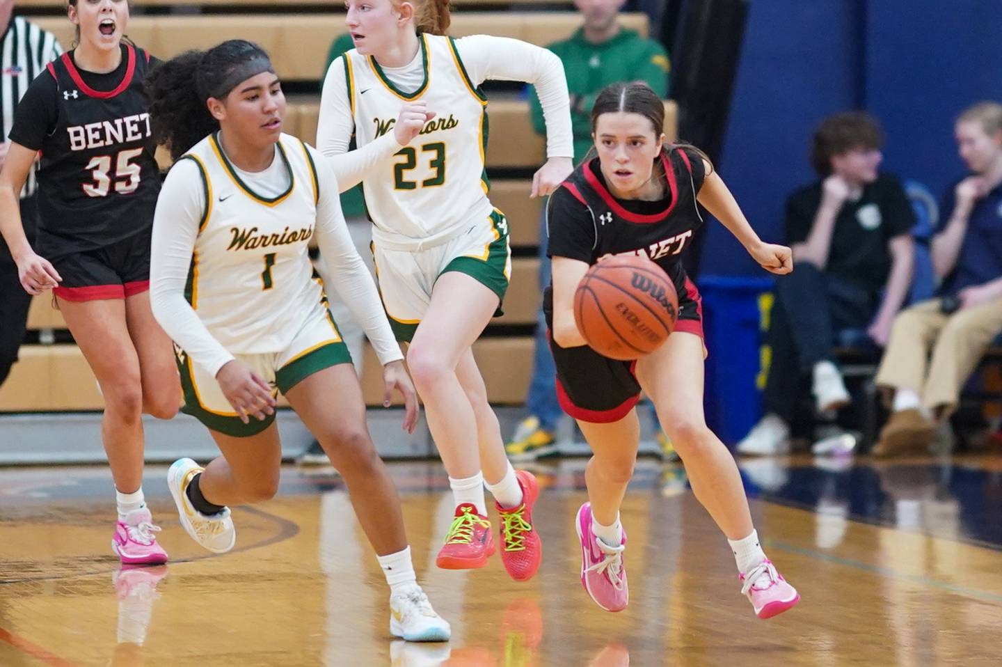 Benet’s Ava Mersinger (21) pushes the ball up the court against Waubonsie Valley's Arianna Garcia (1) during a Class 4A Oswego Sectional final basketball game at Oswego High School on Thursday, Feb 22, 2024.