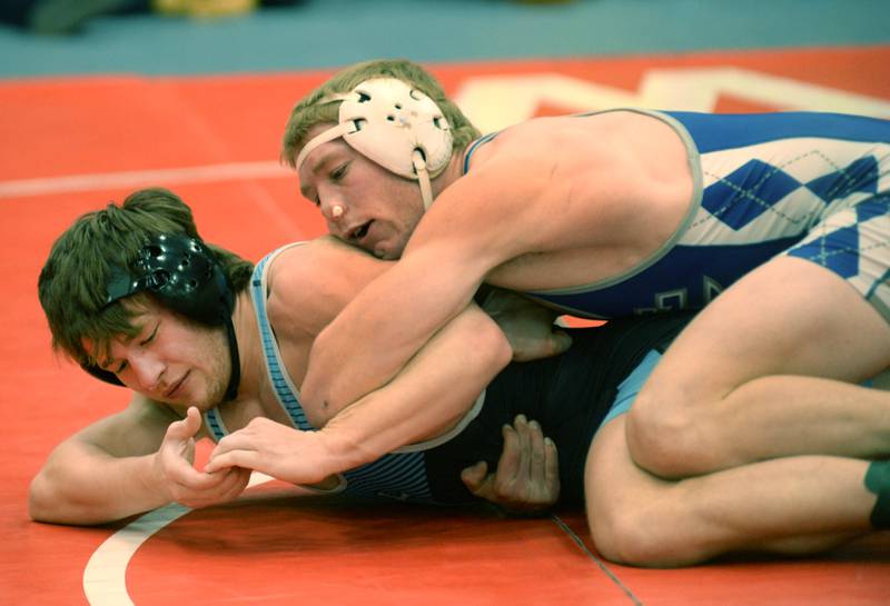 Sterling Newman’s Daniel Kelly (top) and Ottawa Marquette’s Reily Leifheit wrestle at 165 pounds at the 1A Oregon Sectional on Friday, Feb. 14, 2025.