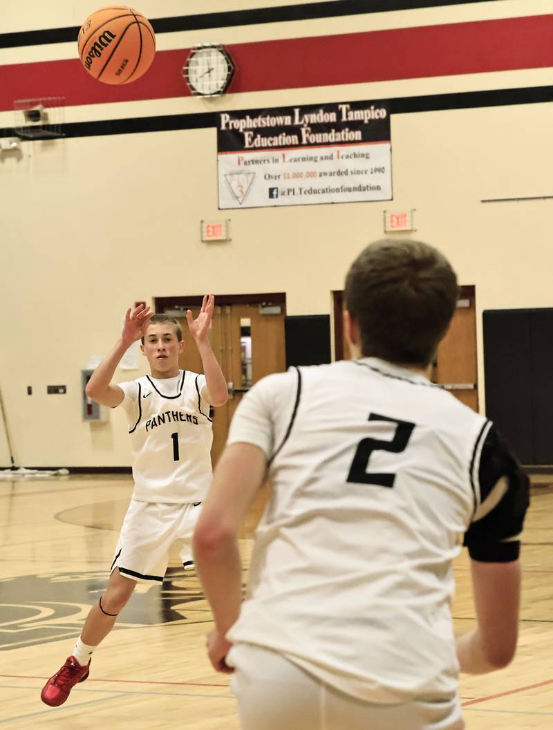 EP’s Caleb Brown keeps the ball moving with a pass to teammate Connor Keegan Monday, Dec. 1, 2025, in Prophetstown. The Panthers hosted the final game of the Turkey Shoot Out, beating the visiting Rock Falls Rockets 57-53