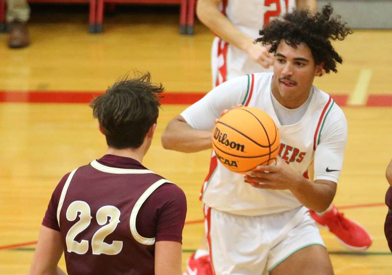 L-P's Marion Persich looks to pass the ball off around Morris's Brett Bounds on Friday, Dec. 6, 2024 in Sellett Gymnasium at L-P High School.