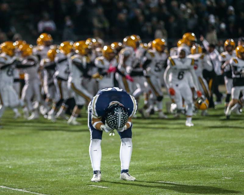 IC Catholic Prep's Eric Karner (19) is overcome with emotion after they were defeated by St Laurence in their Class 4A third round playoff football game between St Laurence at IC Catholic Prep.  Nov 11, 2023.