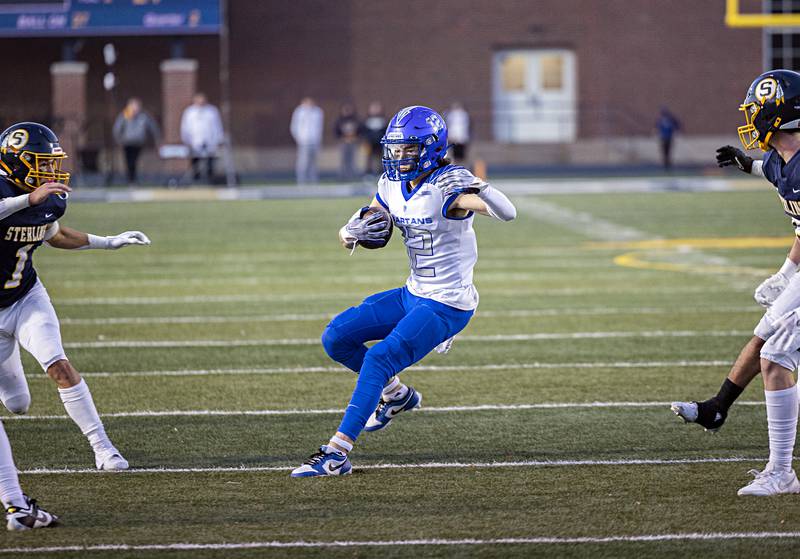 St. Francis’s Dario Milivojevic runs the ball after a catch against Sterling Saturday, Nov. 4, 2023 in a class 5A playoff game in Sterling.