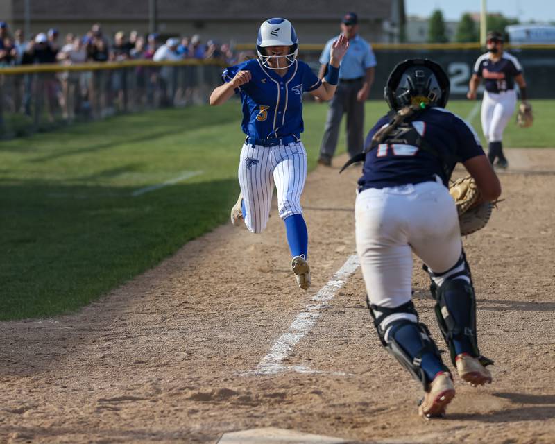 Wheaton North's Moriah Herr (3) races toward home during Class 4A Plainfield North Sectional final softball game between Wheaton North at Oswego. May 31th, 2024.
