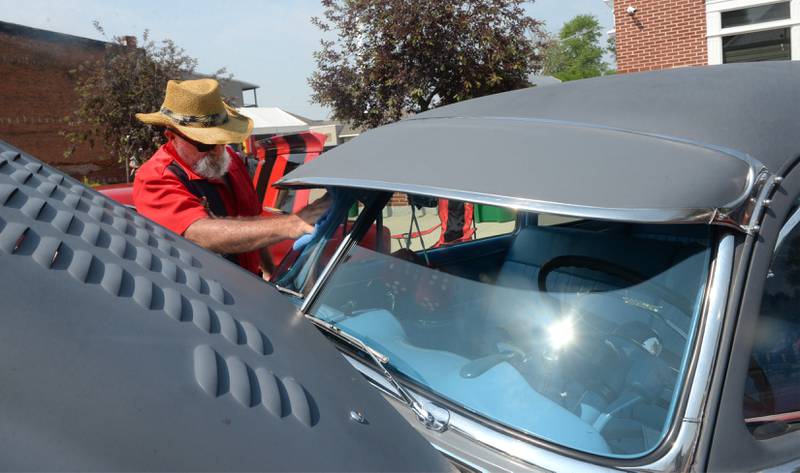Dave Dean of Polo washes the window on his 1949 Pontiac Silver Streak at the Milledgeville car show on Sunday, June 4. The Oregon Lions Club's Father's Day car show is June 18. Polo's annual car show is in August.