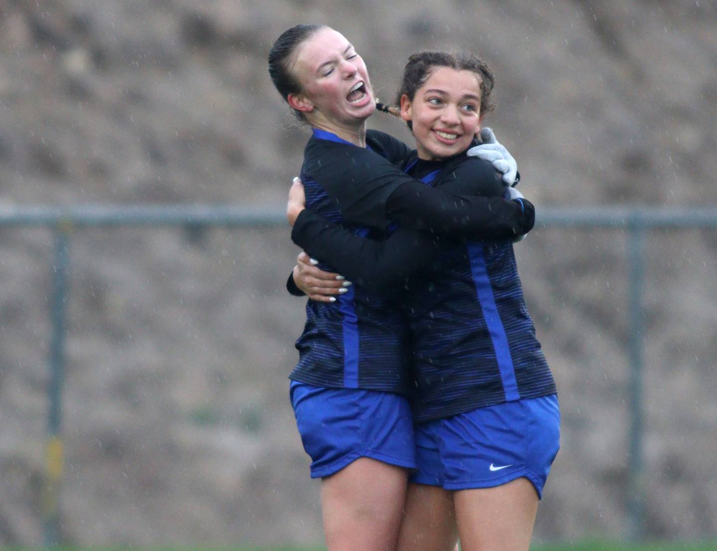 Burlington Central’s Kendall Grigg, left, and Sydney Batts celebrate a play during a game against Crystal Lake Central in varsity soccer at Burlington Thursday night.