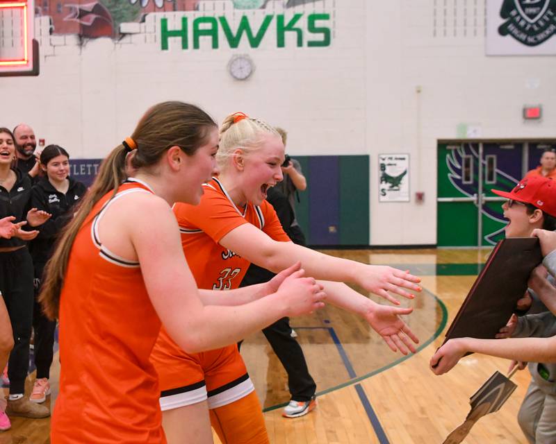 St. Charles East's Kathlyn Bainbridge, left, and St. Charles East's Addison Schilb, step forward to receive the 4A Sectional championship game plaque after defeating Glenbard West on Thursday Feb. 26, 2026, held at Bartlett High School.
