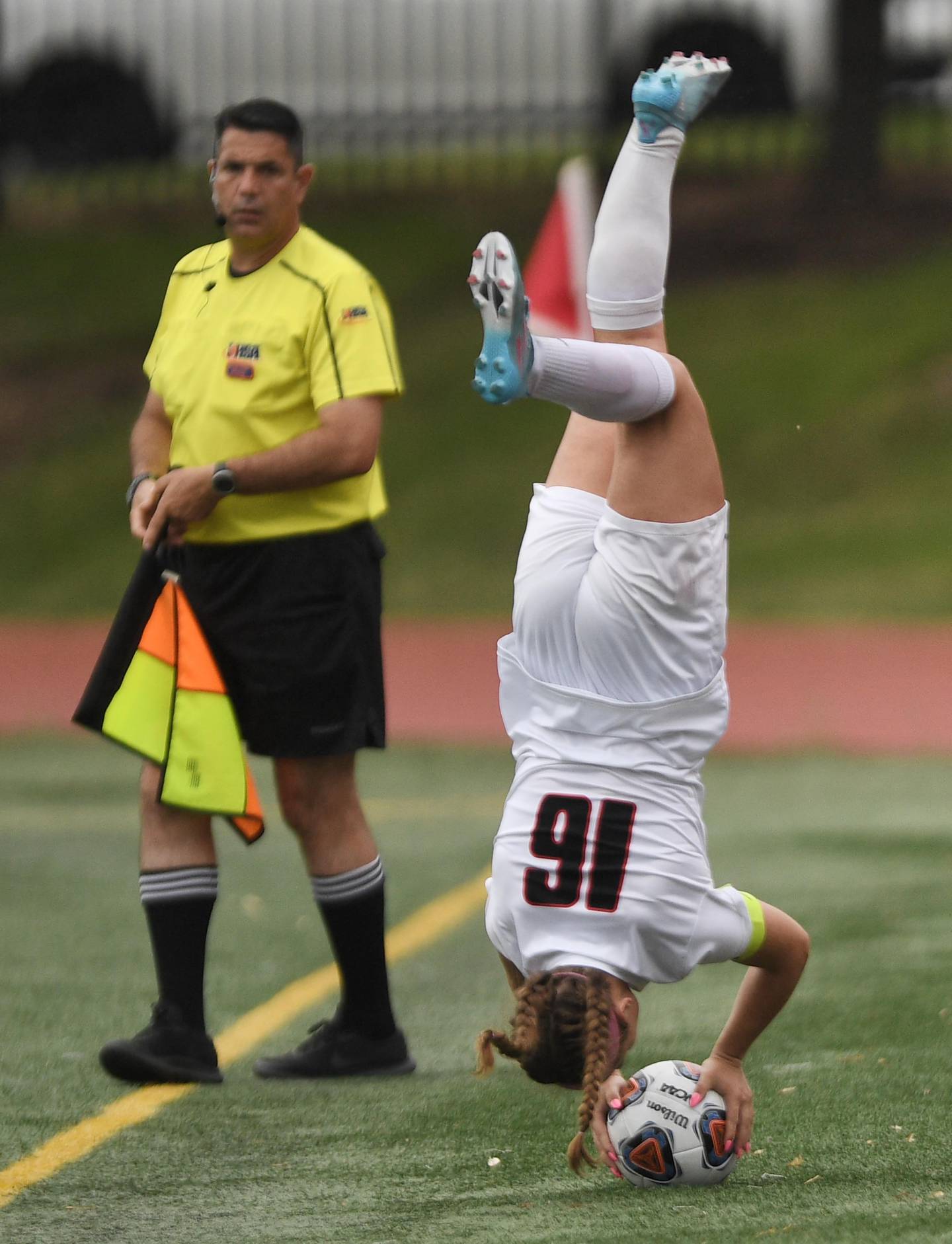 Lincoln-Way Central’s Grace Grundhofer flips on her throw-in against Evanston in the Class 3A IHSA state girls soccer third-place game in Naperville on Saturday, June 4, 2022.