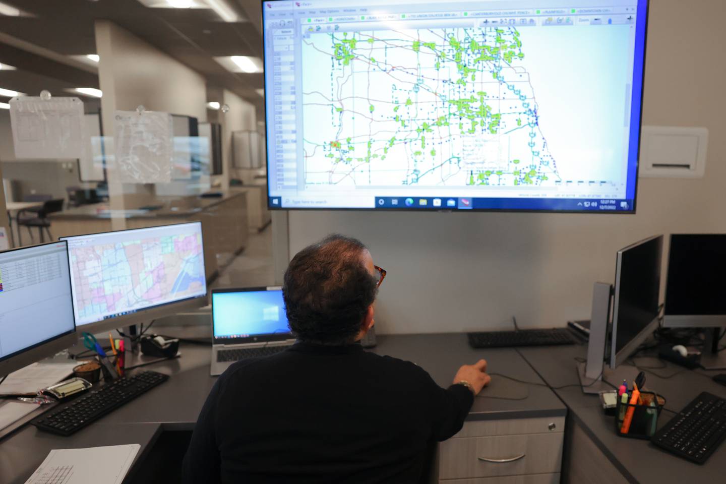 David Dines, Superintendent of Transportation, monitors all the Pace vehicles on the road in Chicago and surrounding suburbs in the dispatch room at the New Heritage Plainfield Facility.