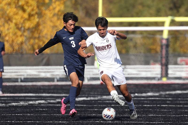Bolingbrook’s Saul Malacara works the ball against West Aurora’s Diego Munoz in the Class 3A Bolingbrook Regional championship match on Saturday, Oct. 26, 2024 in Bolingbrook.