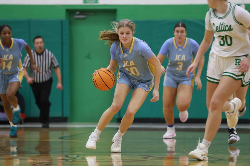 Joliet Catholic’s Emma Napier takes the ball upcourt against Providence on Saturday, Dec. 5, 2025 in New Lenox.