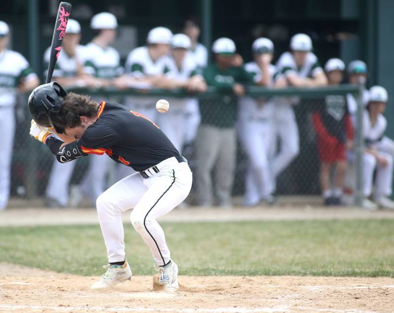 Batavia’s Katcher King gets hit by a pitch during a game against Glenbard West at Village Green Park in Glen Ellyn on Wednesday, March 13, 2024.