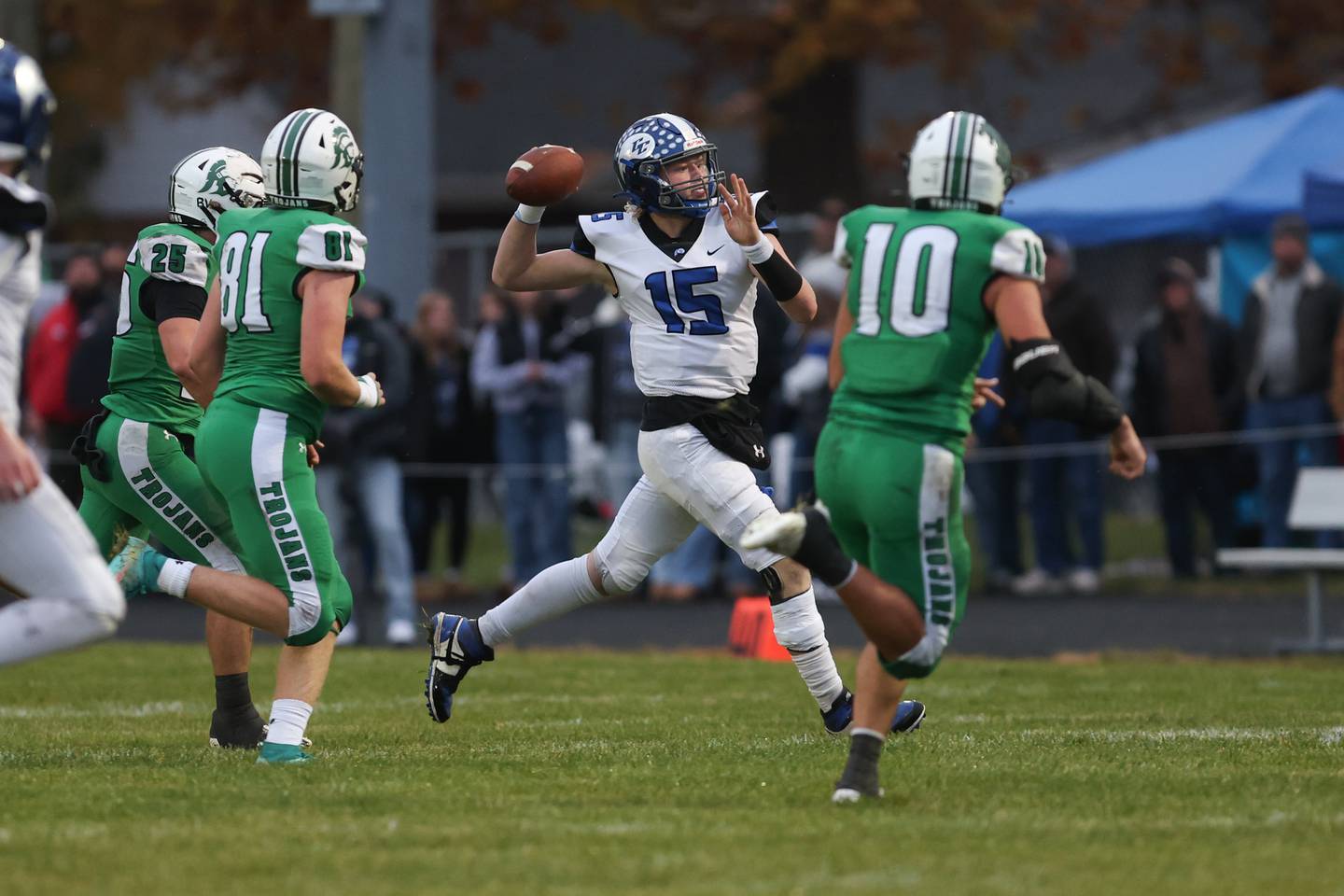Clifton Central senior quarterback Brady Shule throws a pass under pressure from Dwight defenders during Dwight's 43-14 victory over Clifton Central in second round playoffs on Saturday, Nov. 8, 2025.