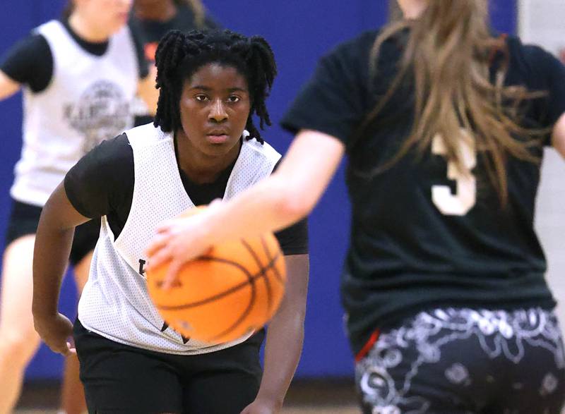 Kaneland’s Amani Meeks guards DeKalb’s Olivia Schermerhorn Thursday, June 12, 2025, in the Geneva High School Varsity Summer League.