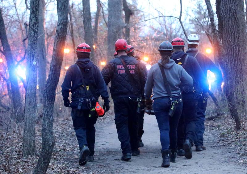 Firefighters carry a paitent from French Canyon who fell 20-30 feet on Tuesday, April 1, 2025 at Starved Rock State Park. A Mutual Aid Box Alarm System (MABAS) prompted rope and rescuers as far as Marseilles and Princeton.