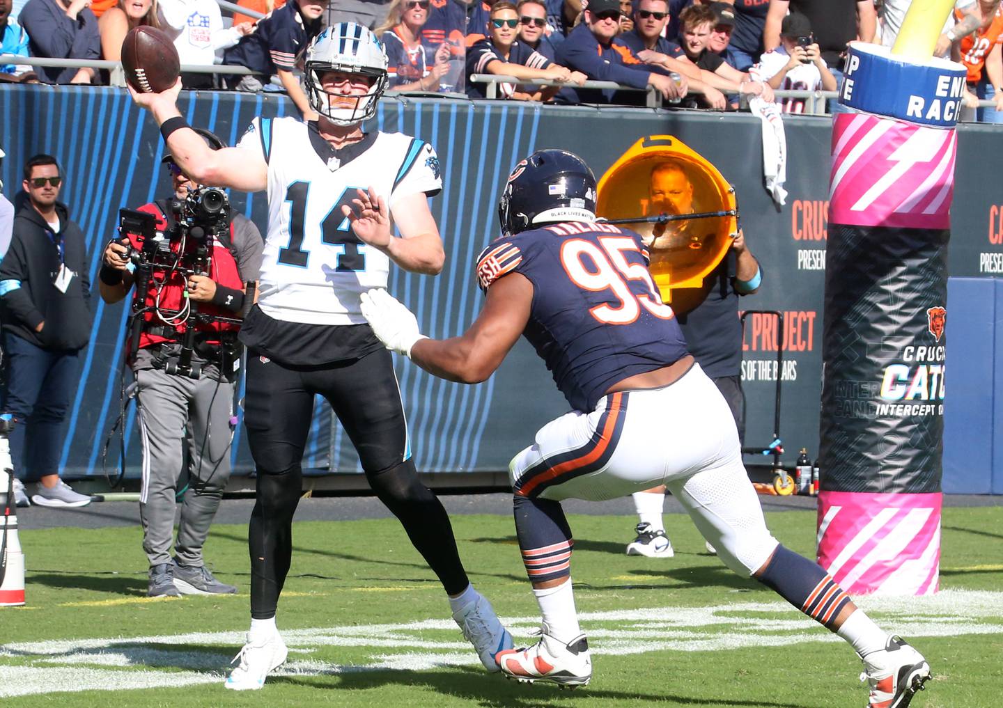 Carolina Panthers quarterback Andy Dalton throws out of the back of the end zone as Chicago Bears defensive lineman DeMarcus Walker applies pressure on Sunday, Oct. 6, 2024 at Soldier Field in Chicago.