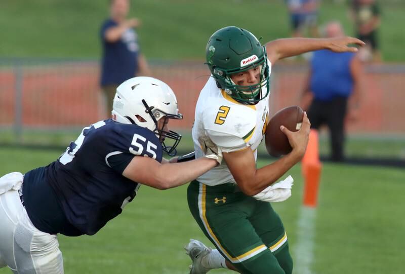 Crystal Lake South’s Caden Casimino is pushed out of bounds by Cary-Grove’s Thomas Burton, left, at Al Bohrer Field on the campus of Cary-Grove High School Friday night.