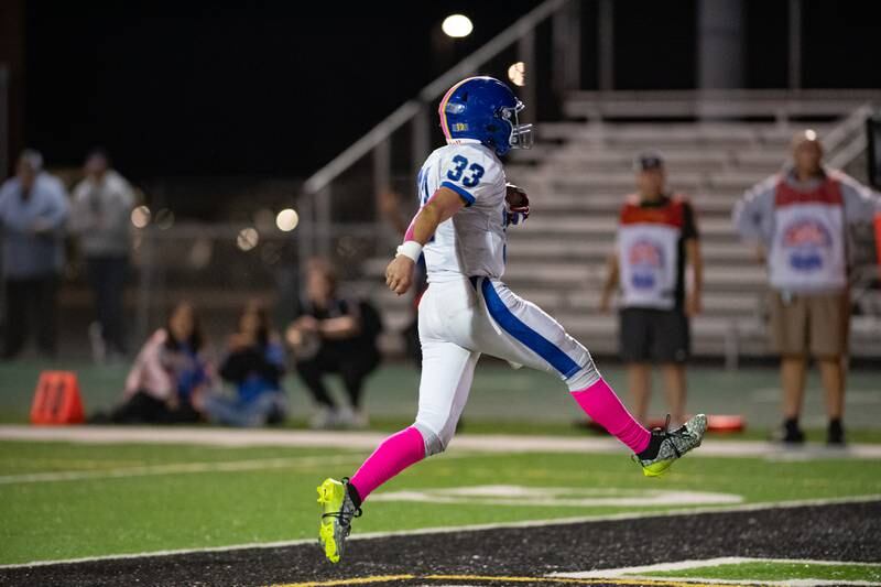 Joliet Central's Paul Slick celebrates a touchdown during a game against Plainfield Central on Friday Oct. 11, 2024 at Plainfield Central High School