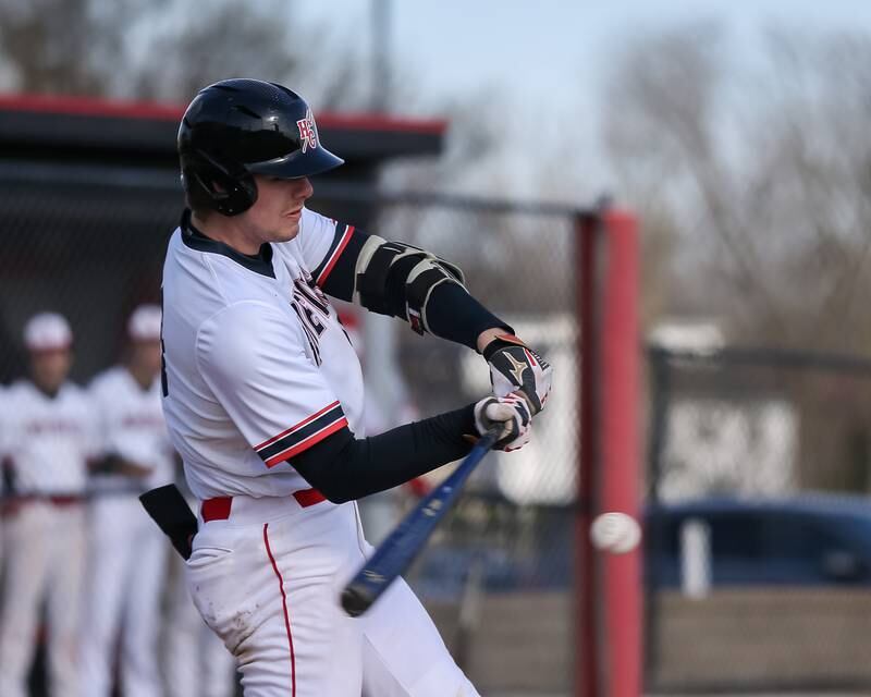 Hinsdale Central's Luke Adams (18) swings at a pitch during baseball game between Lyons at Hinsdale Central. April 19, 2022.