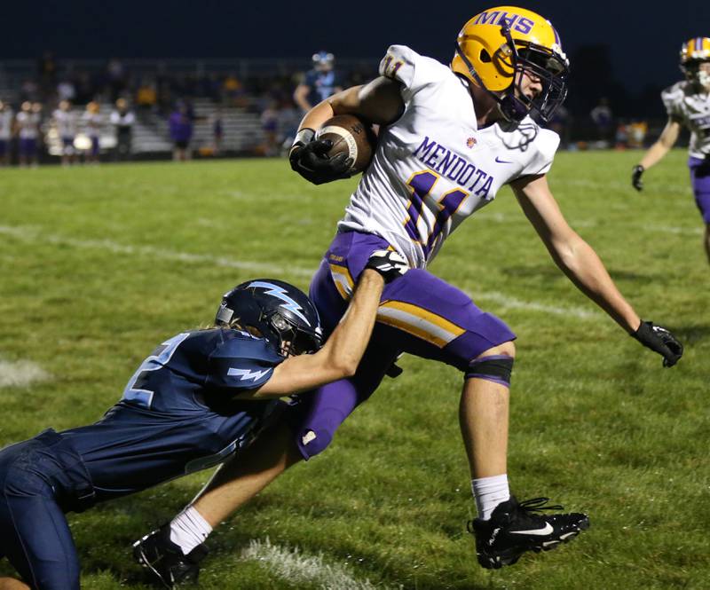 Mendota's Aden Tilman runs the ball as he is brought down by Bureau Valley's Drake Hardy on Friday, Sept. 22, 2023 at Bureau Valley High School.
