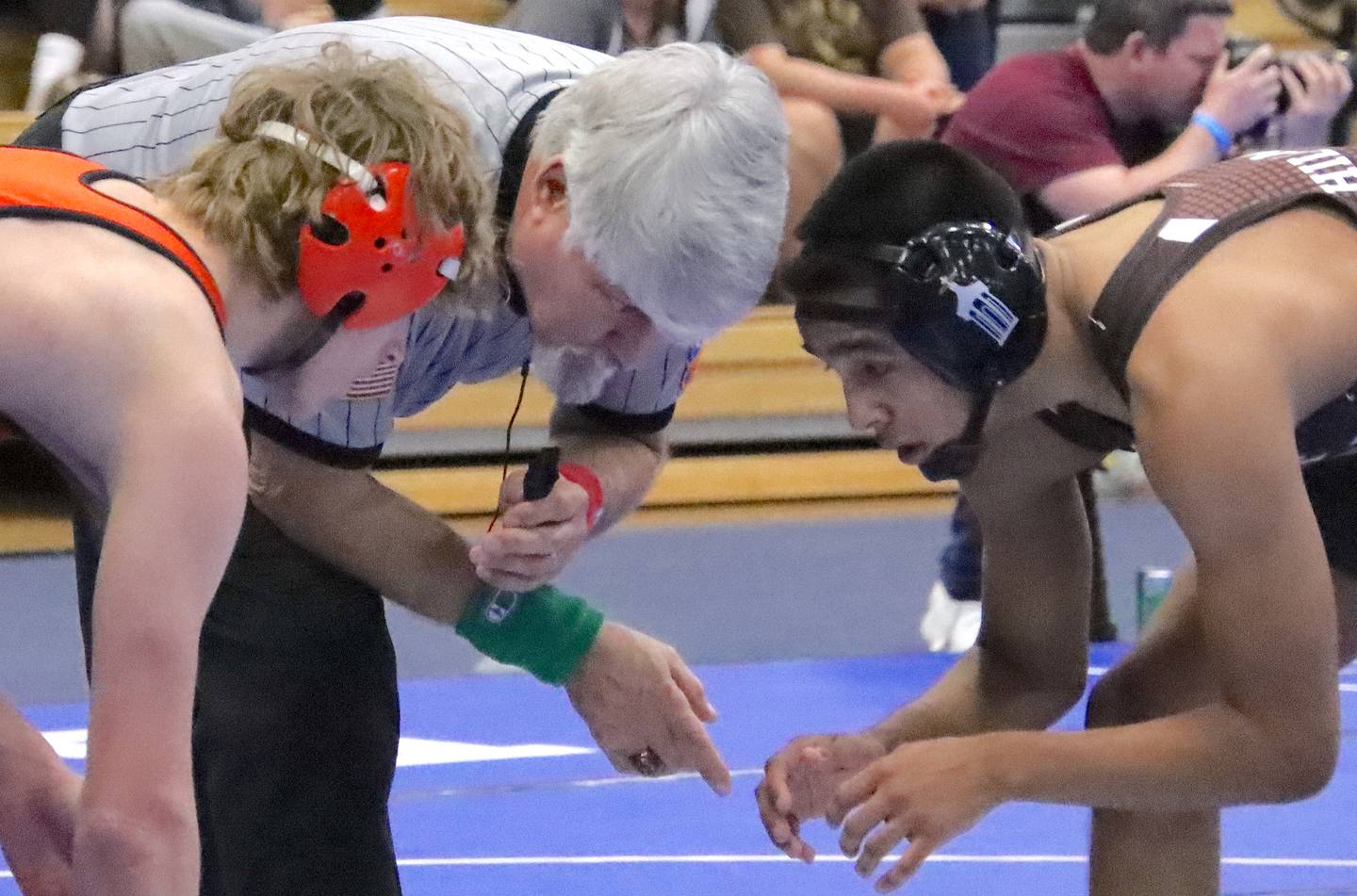 Minooka's Cale Stonitsch and Joliet Catholic's Damien Flores are about to lock horns in the 132-pound final at the Class 3A Quincy Sectional on Saturday.