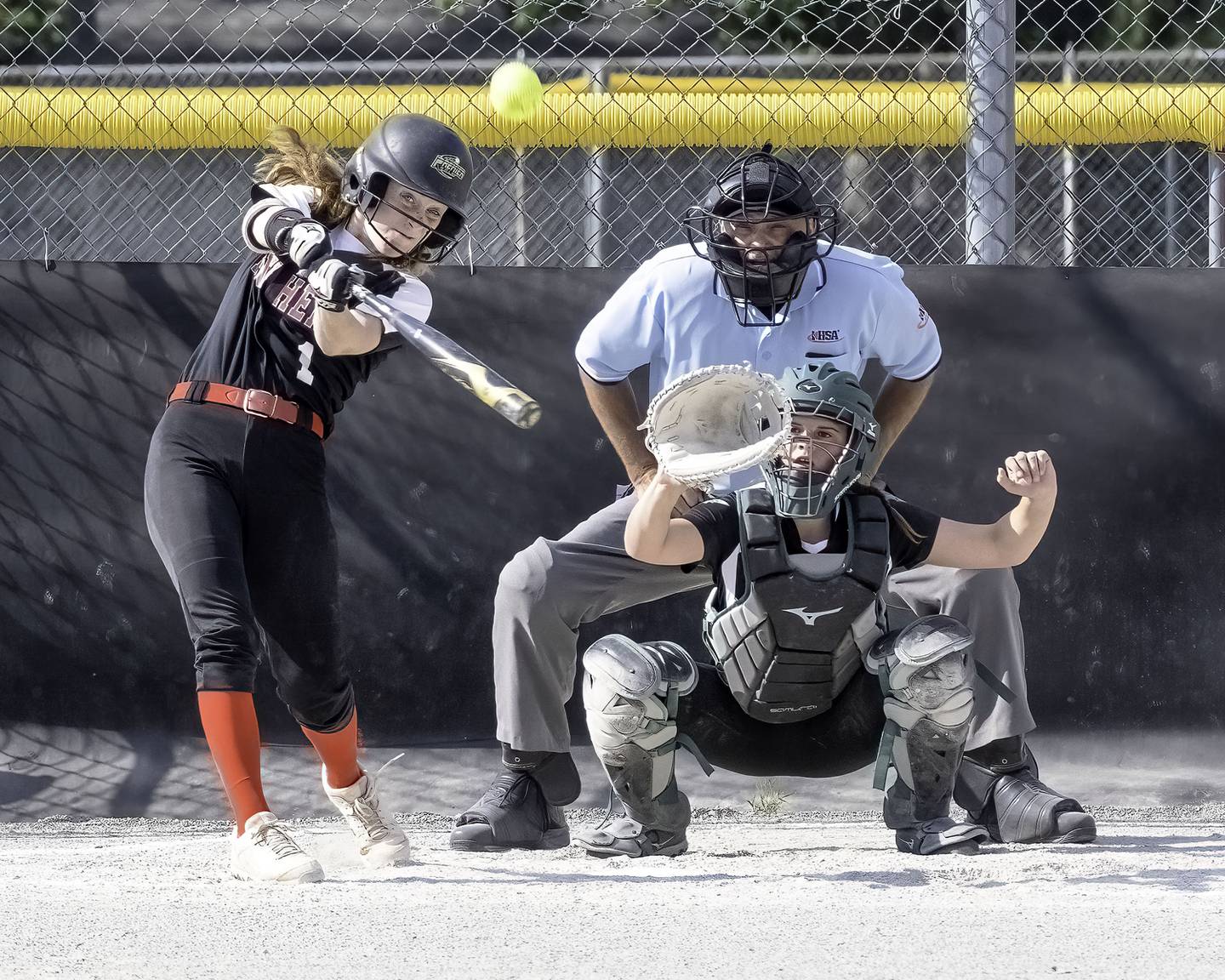 Erie-Prophetstown's Jaden Johnson hits fly ball to center field during Thursday’s 2A regional semifinal in Prophetstown. Rock Falls' Calire Bickett made the catch for an out.