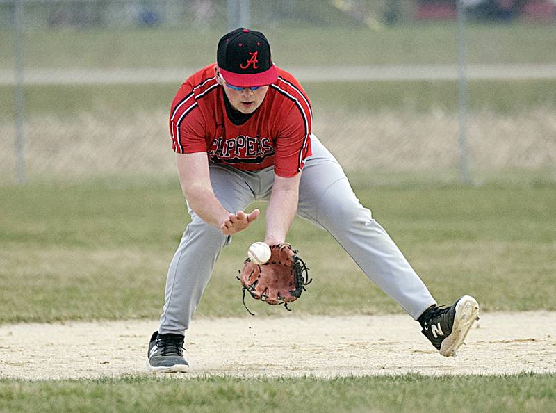 Amboy’s Carson Barlow scoops a grounder at third against Oregon Thursday, March 21, 2024 in Oregon.