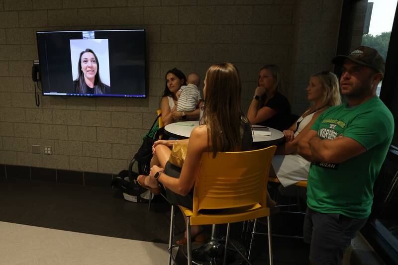 A group watches Breanne Guzan, wife of Brad Guzan, do a video chat with the attendees at the Providence Catholic Brad Guzan watch party on Tuesday, July 25 in New Lenox. Guzan is a Providence Catholic alumnus who plays goalie for MLS’ Atlanta United FC.