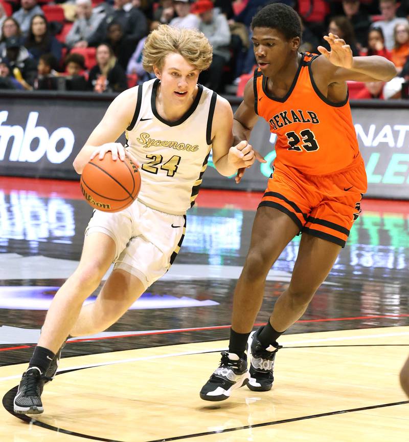Sycamore's Lucas Winburn drives around DeKalb's Davon Grant during the First National Challenge Friday, Jan. 27, 2023, at The Convocation Center on the campus of Northern Illinois University in DeKalb.