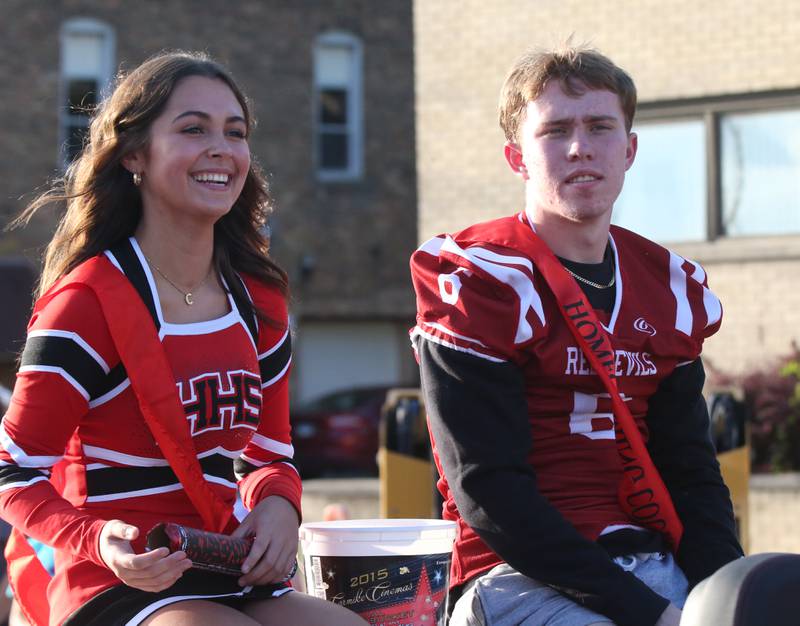 Hall queen and king candidates Cecilia Verucchi and Caleb Bickett ride in the Hall High School Homecoming parade on Thursday, Sept. 28, 2023 in Spring Valley. Verucchi was crowned 2023 Homecoming queen during an assembly after the parade.