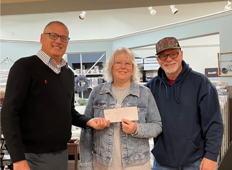 Rick Clary, a board member with Green River Community Fund, announced the group donated $5,000 to Second Story Teen Center’s new building project.