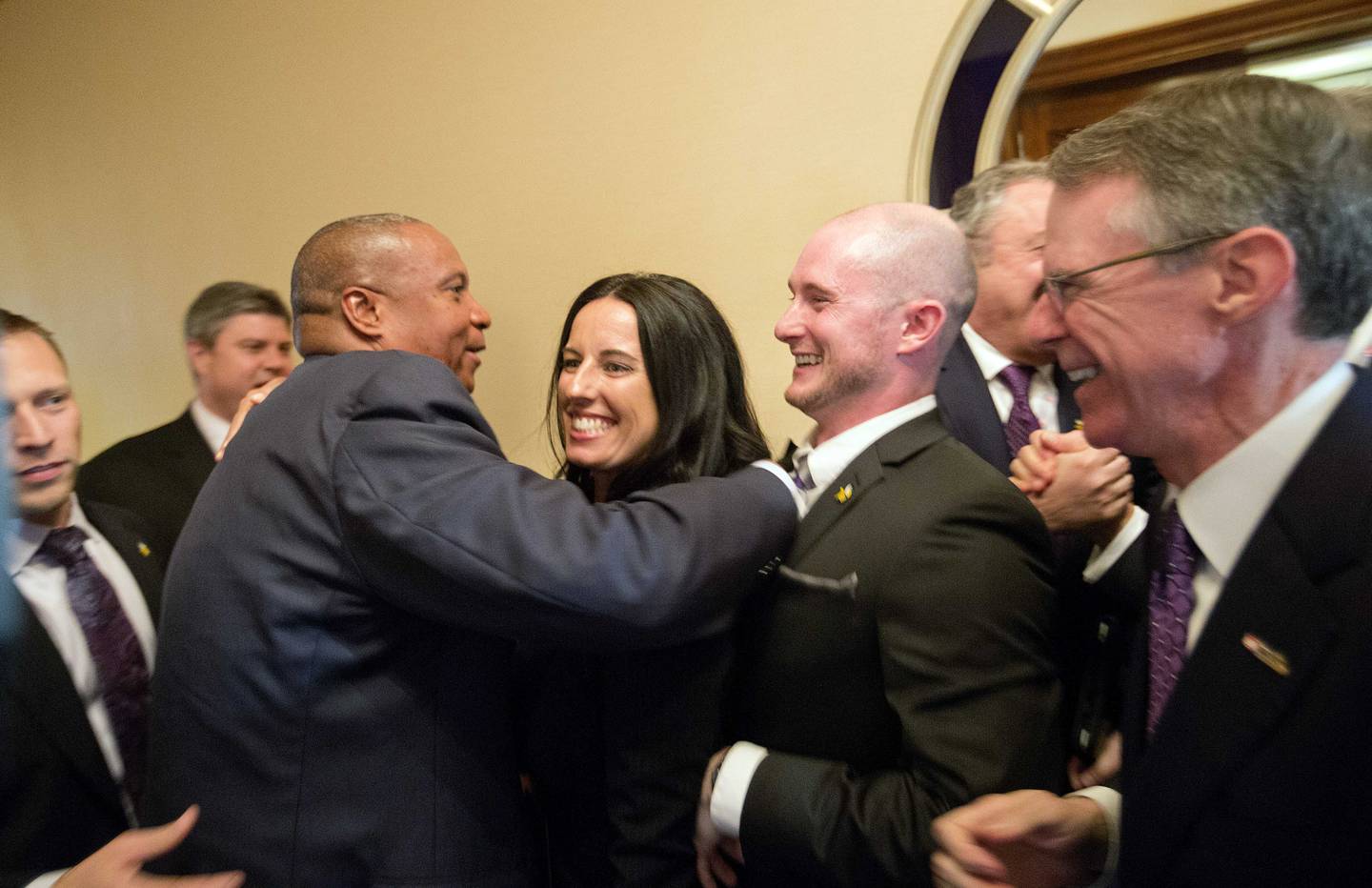 Members of the Minnesota Vikings front office, Kevin Warren, center left, Tanya Dreesen, center, and Matt Muenier, center right, celebrate with Richard Davis, right, CEO of U.S. Bank and the  Minneapolis bid committee co-chair, after Minneapolis was selected as the host for 2018 Super Bowl at the NFL's spring meetings, Tuesday, May 20, 2014, in Atlanta.