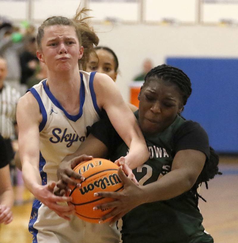 Johnsburg's Skye Toussaint battles with St. Edward's Sanaii McPherson for a rebound during the IHSA Class 2A Johnsburg Sectional girls basketball championship game on Thursday, February, 26, 2026, at Johnsburg High School.