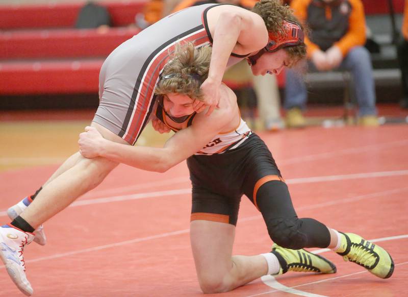 Ottawa's Sebastian Cabrera wrestles Sandwich's Josh Lehman on Thursday, Jan. 12, 2023 in Kingman Gymnasium at Ottawa High School.