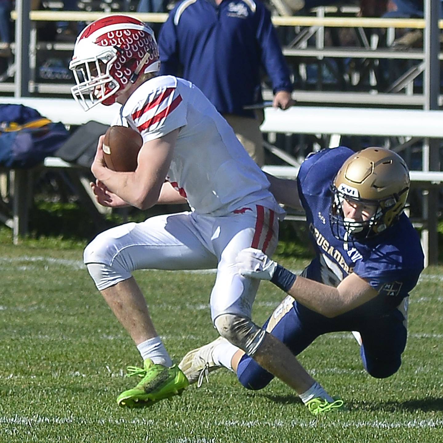 Marquette’s Tom Durdan is held back by Colton Bielema on a run in the 1st quarter during the Class 1A first round playoff game on Saturday, Oct. 29, 2022 at Gould Stadium in Ottawa.