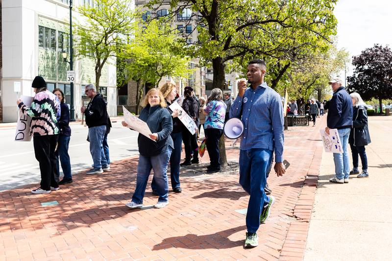 Patrick Watson, an executive board member with Indivisible Illinois, spreads a message of solidarity during the May Day Weekend Rally in Downtown Joliet on May 3, 2025.