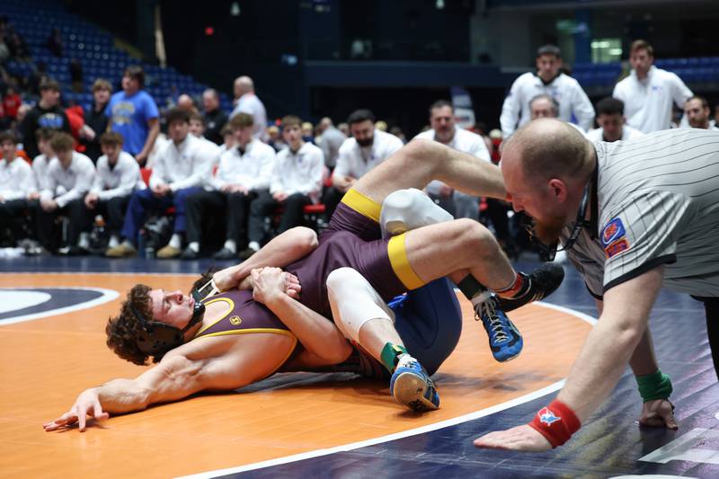 Montini's Will Konder avoids the pin by Marmion Academy's Ashton Hobson in the 157-pound match during Marmion Academy's victory over Montini in the IHSA Class 3A Dual Team State championship on Saturday, Feb. 28, 2026.
