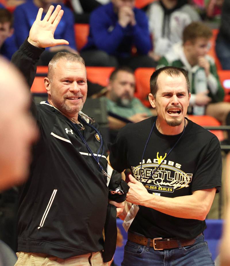 Jacobs’ coaches celebrate Dominic Ducato’s win over Bradley-Bourbonnais’ Ethan Spacht during the Class 3A 113 pound 3rd place match in the IHSA individual state wrestling finals in the State Farm Center at the University of Illinois in Champaign.