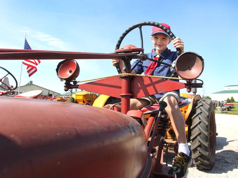 Russell Poynor, 7, of Grayslake is all smiles as he sits on a McCormick Farmall Model H tractor during the Lake County Farm Heritage & Harvest Festival at the Lake County Fairgrounds on September 23rd in Grayslake. The festival was sponsored by the Lake County Farm Heritage Association.
Photo by Candace H. Johnson for Shaw Local News Network