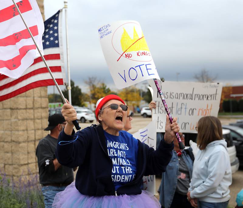 Theresa Freet of Spring Grove yells during a "No Kings” protest rally on Saturday, Oct. 18, 2025, along Route 31 in McHenry. The protest drew thousands of protesters to the area to protest the policies of President Donald Trump.