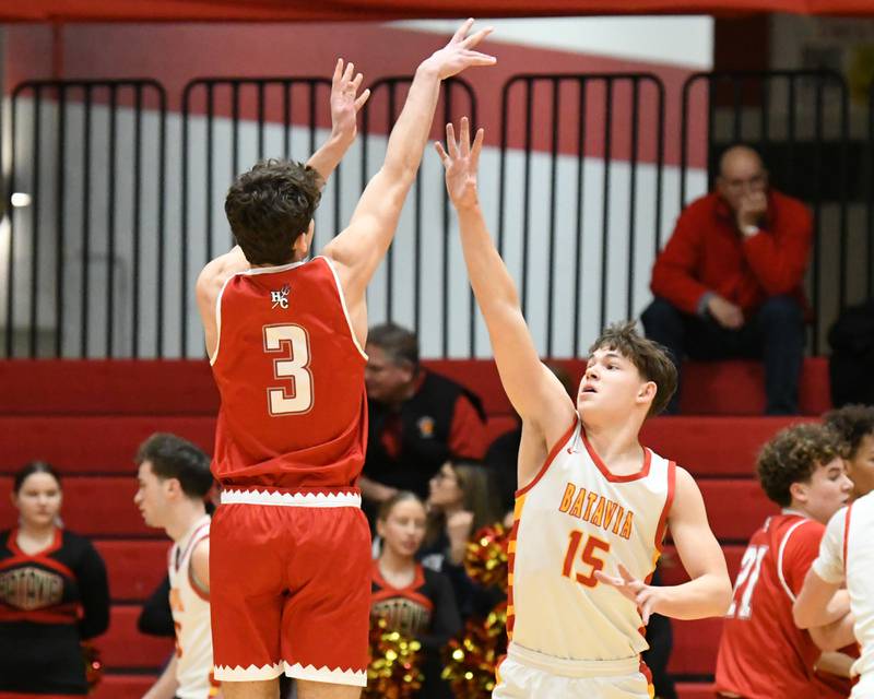 Hinsdale Central's Cole Bero (3) makes a basket during the game on Saturday Jan. 24, 2026, while being defended by Batavia's Dane Farrar (15) held at Batavia High School.